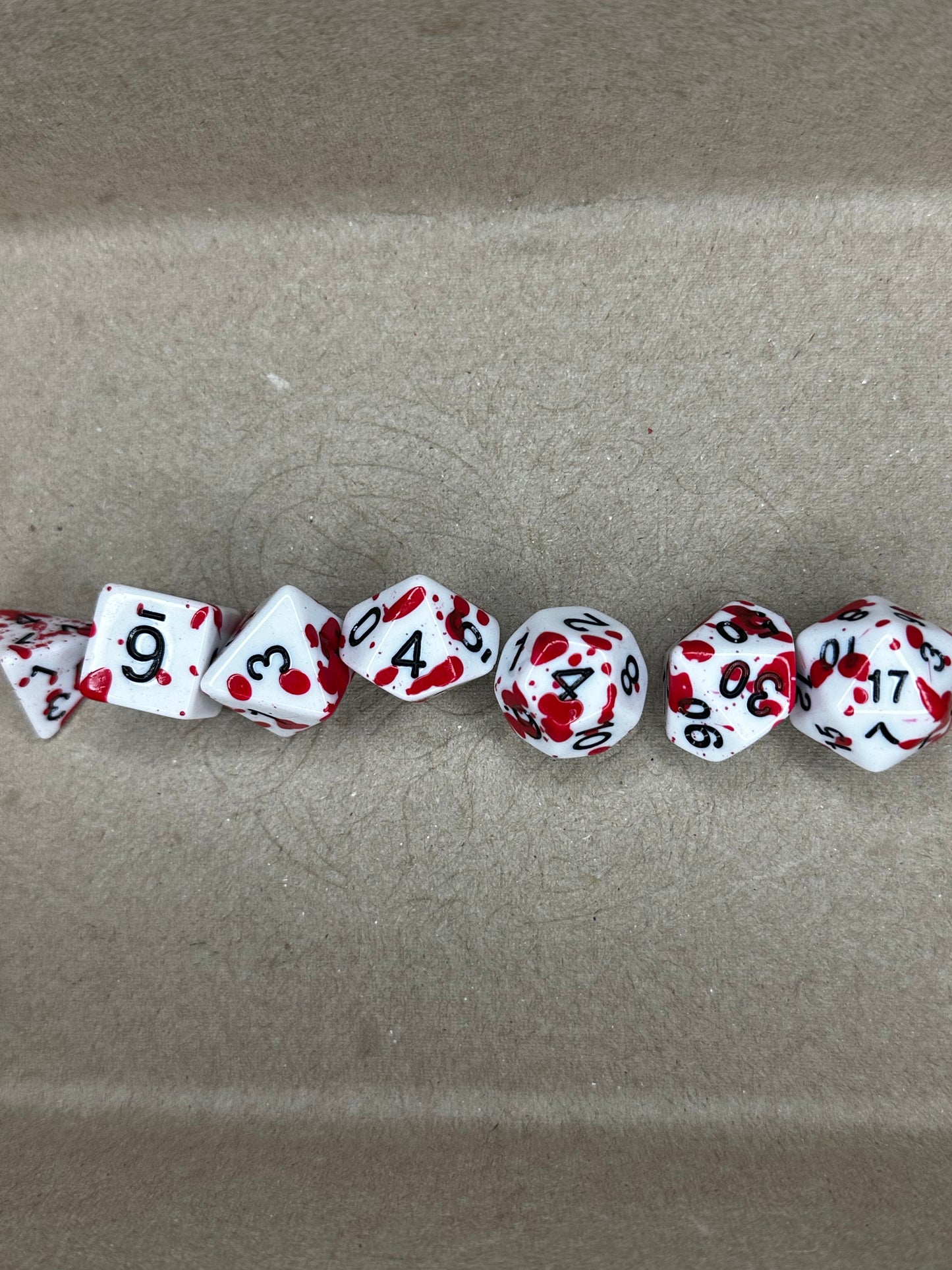 7 pc set of white and red stained dnd tabletop gaming dice